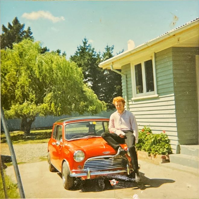 Lyn Hatton sitting on the bonnet of a red Mini