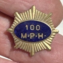 Lyn Hatton's gold starburst badge with blue enamel centre reading 100 M.P.H.