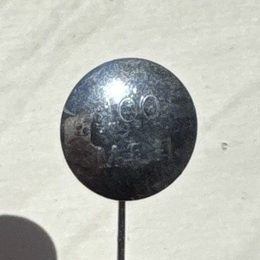 Lyn Hatton's silver pin badge engraved 100 MPH